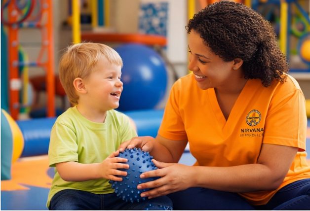 A direct support professional playing with a young child during a therapy session.